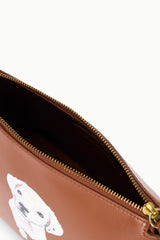 Tan pouch interior view with gold zipper track and white dog print.