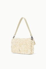 Cream woven shoulder bag with flap and adjustable-length shoulder strap