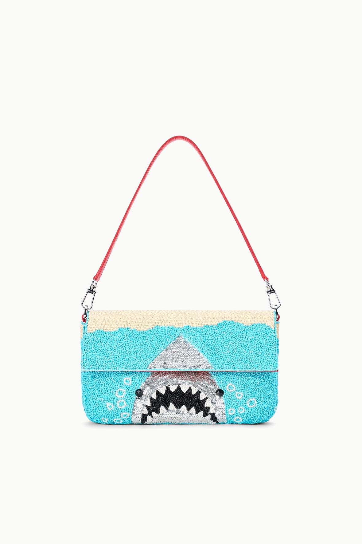 Turquoise sequin shoulder bag with red handles and shark graphic front.