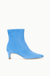 Blue suede ankle boot with mid-height heel and pointed-toe silhouette