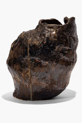 Organic ceramic vase in dark earth glaze, irregular shape and wide mouth