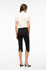 Black cropped pants, back view; slim straight fit