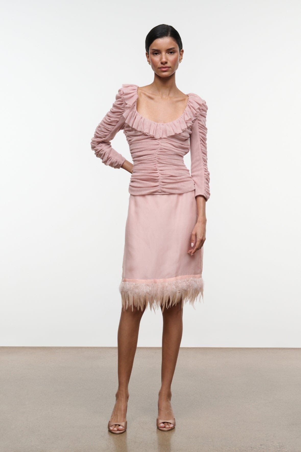 Sandrose ruched mini top in pale pink with ruffle neckline, long gathered sleeves, fringe hem