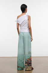 White one-shoulder draped top with bow tie on shoulder, back view
