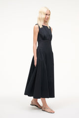 Sleeveless black midi dress with gathered waist and flared skirt