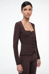 Brown square-neck top with long sleeves, front buttons, and patch pocket detail