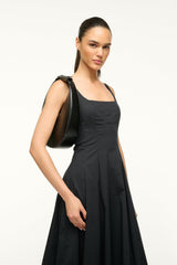 Black crescent hobo bag carried over the shoulder by the top handle