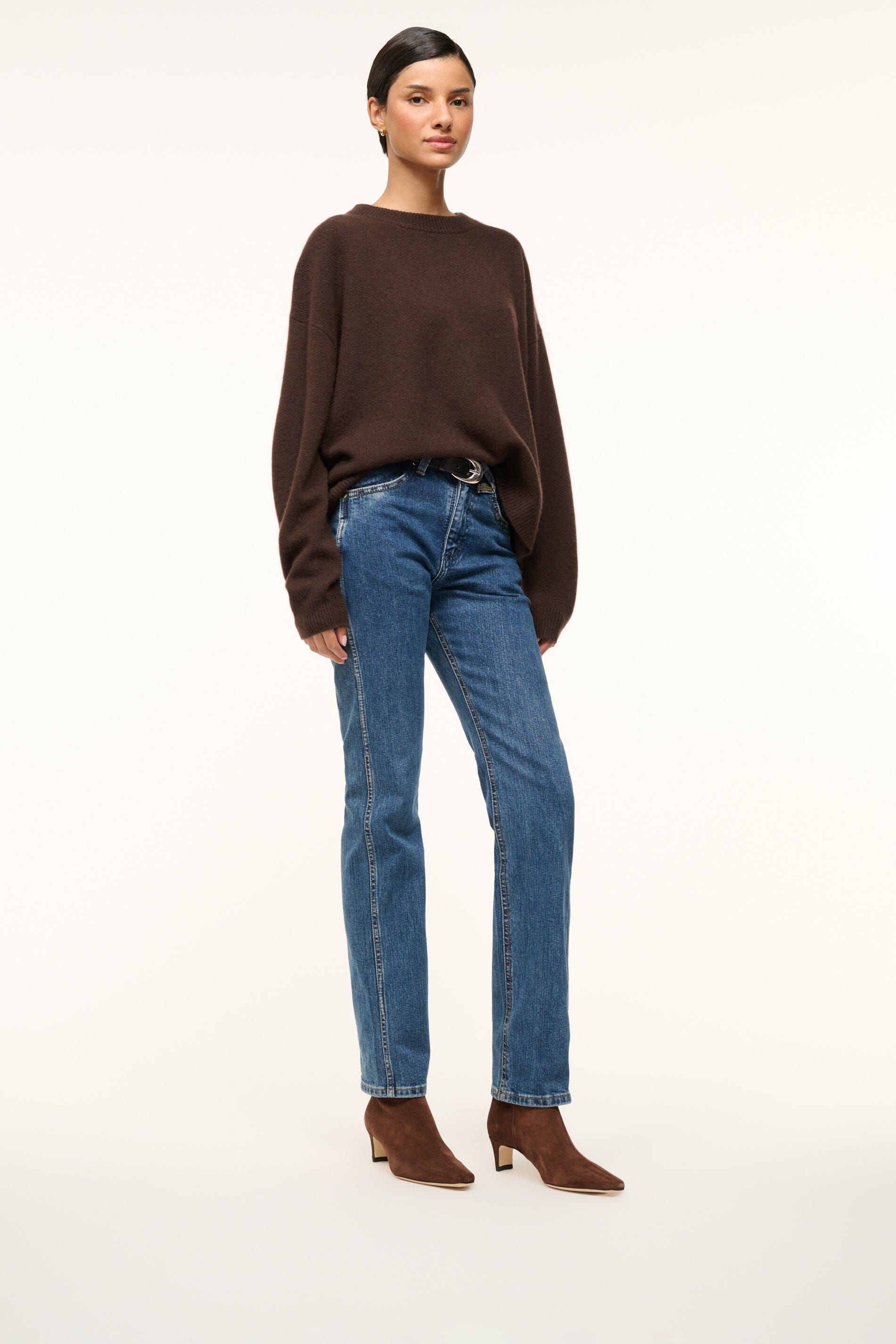 Mahogany suede ankle boot worn with blue jeans; block heel and pointed toe