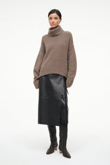 Tall woven leather boots, dark espresso brown, mid-calf height with low heel.