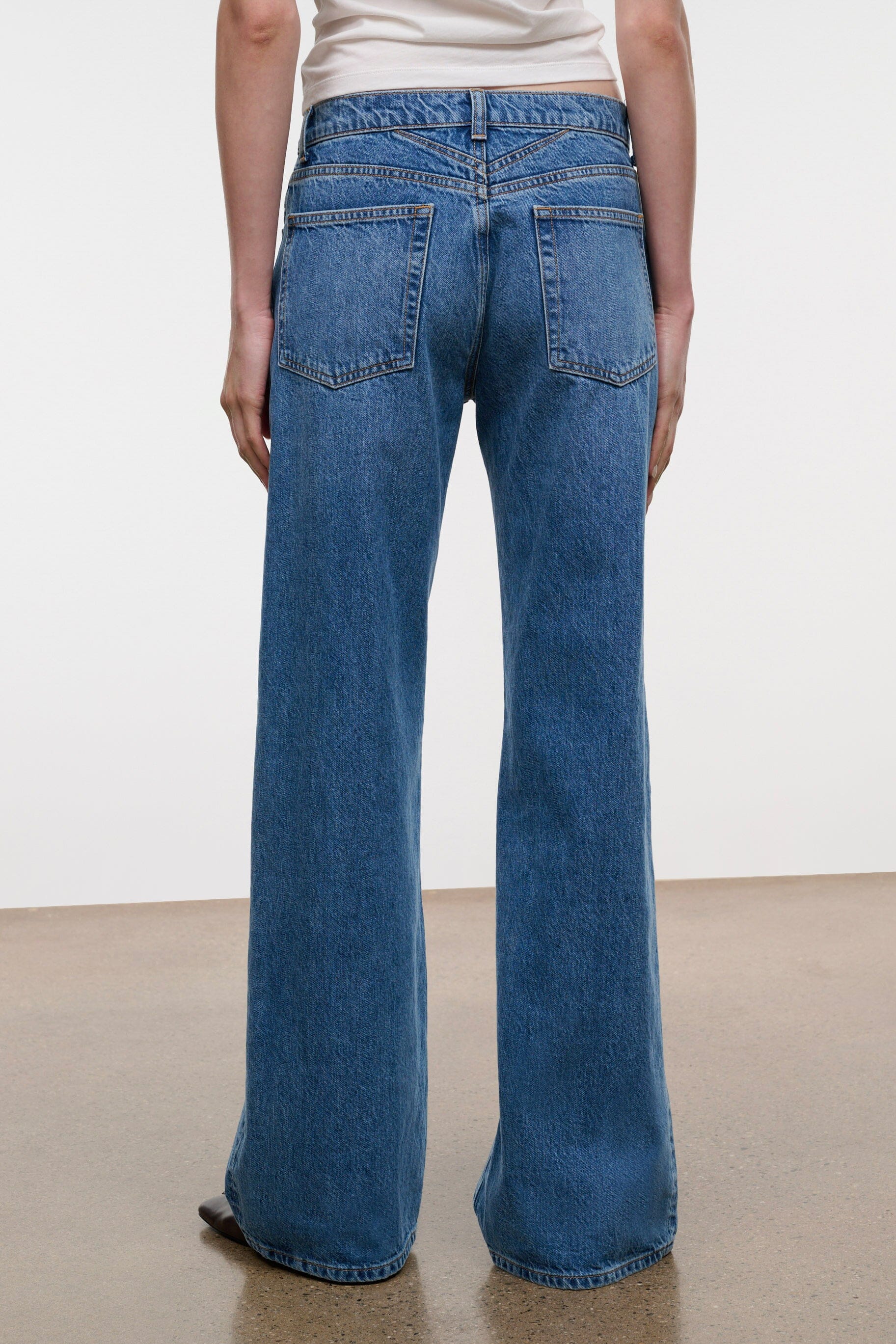 Relaxed-fit vintage wash jeans, rear waistband and yoke detail