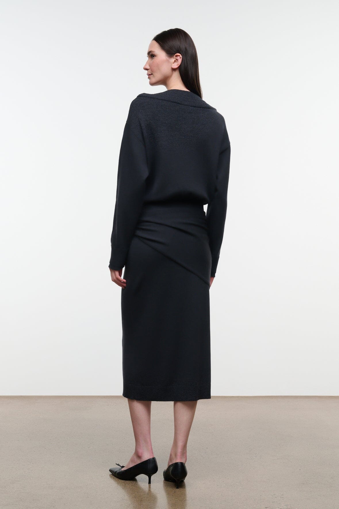 Charcoal sweater dress, midi length, long sleeves, and knotted waist detail