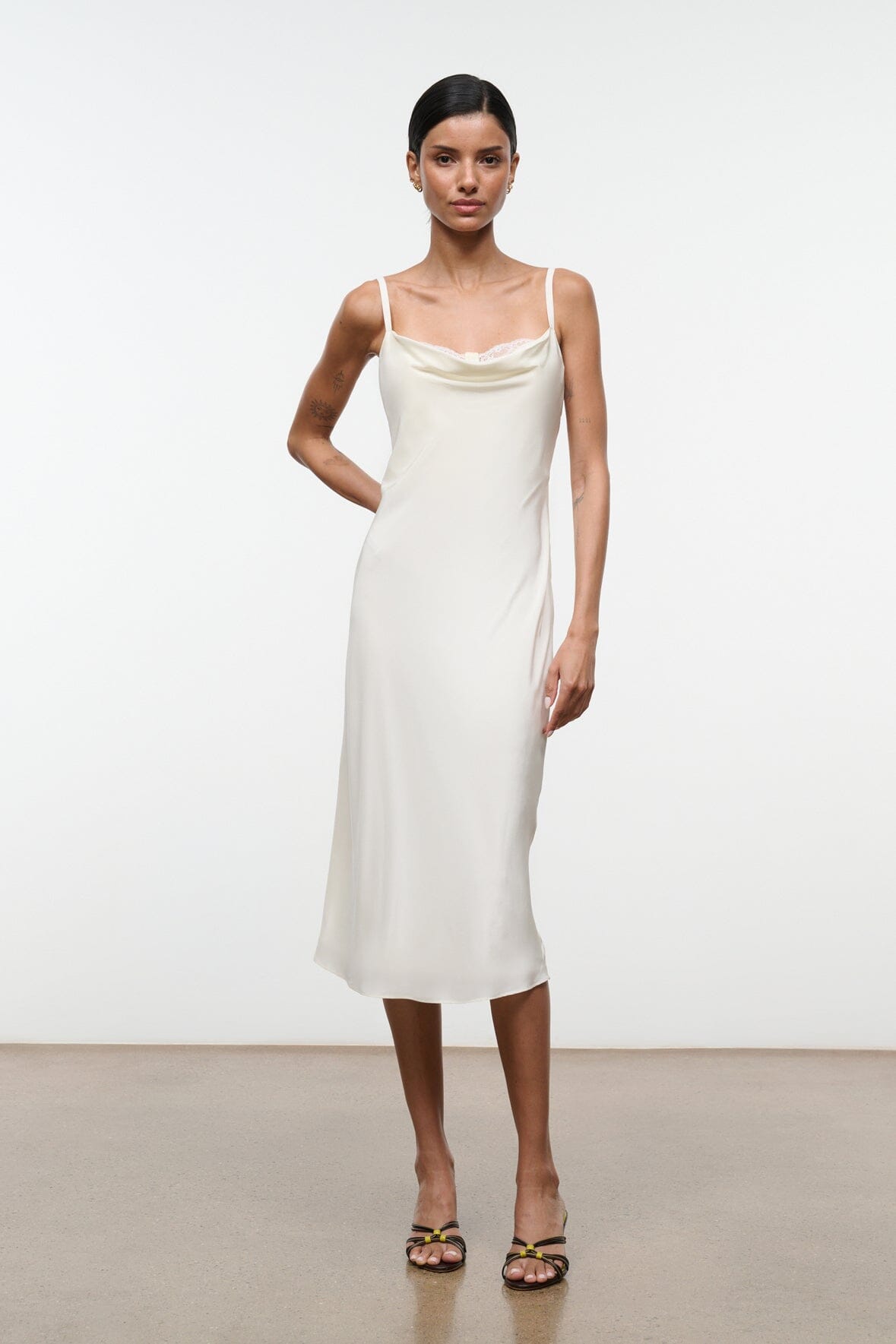 Ivory silk midi slip dress with spaghetti straps and scoop neckline