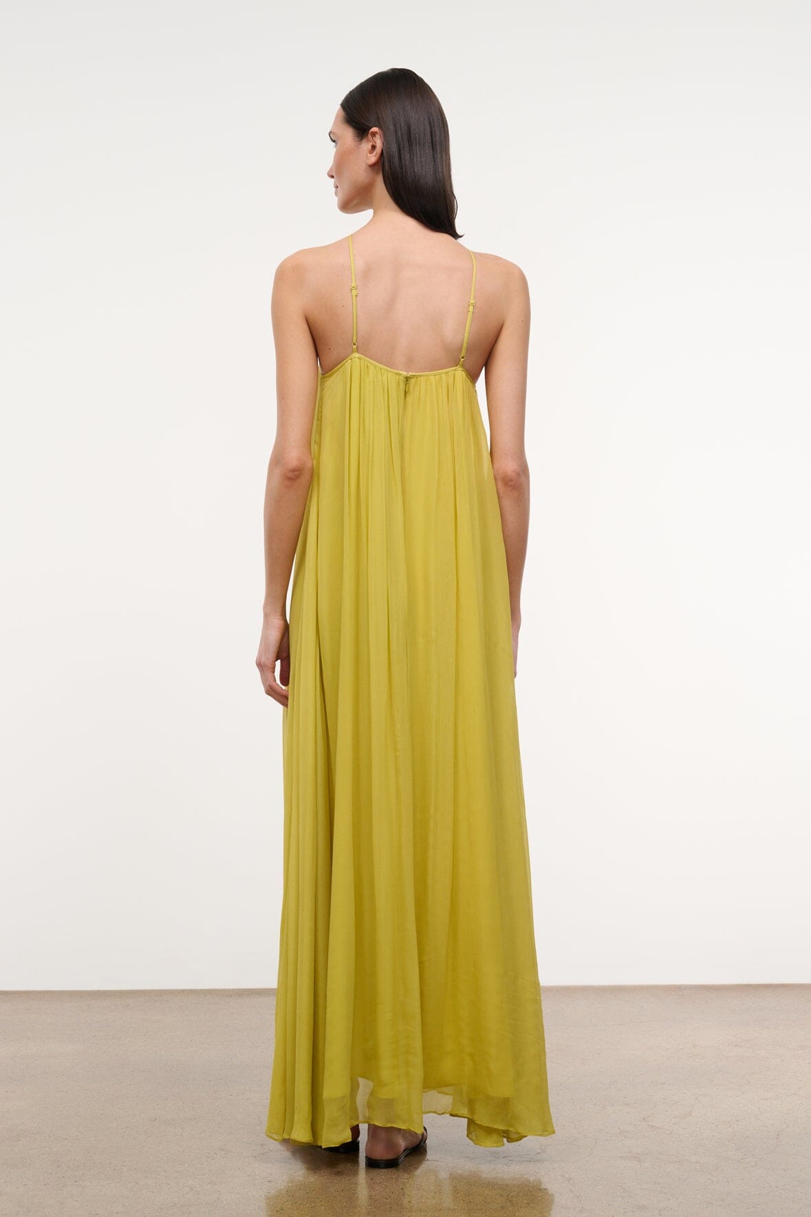 Citron yellow halter maxi dress with open back and thin crisscross straps