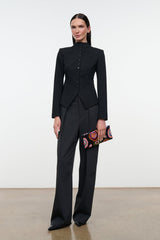 Black long-sleeve jacket with high collar, button front, and sculpted peplum detail