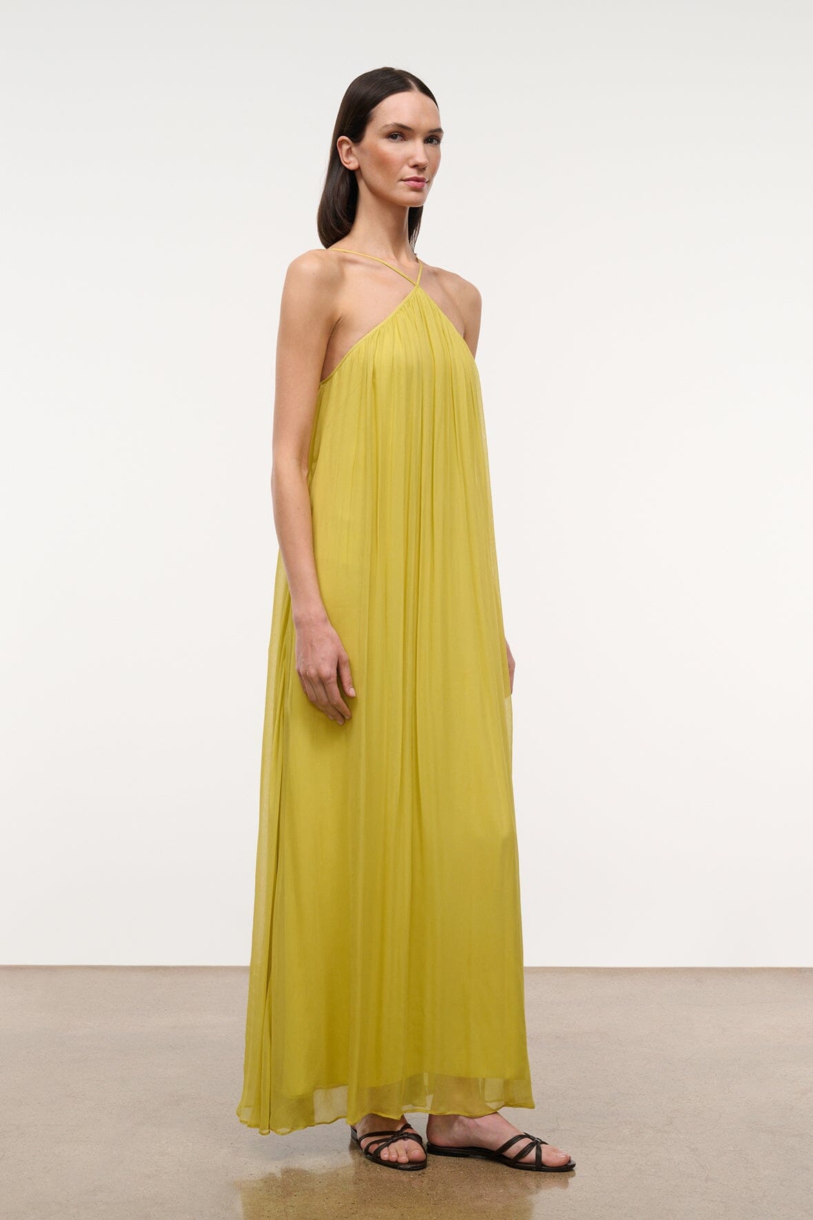 Citron yellow halter maxi dress with draped pleats and crisscross open-back straps