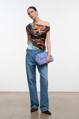 Silk one-shoulder top with draped neckline, brown orange turquoise butterfly print, side view
