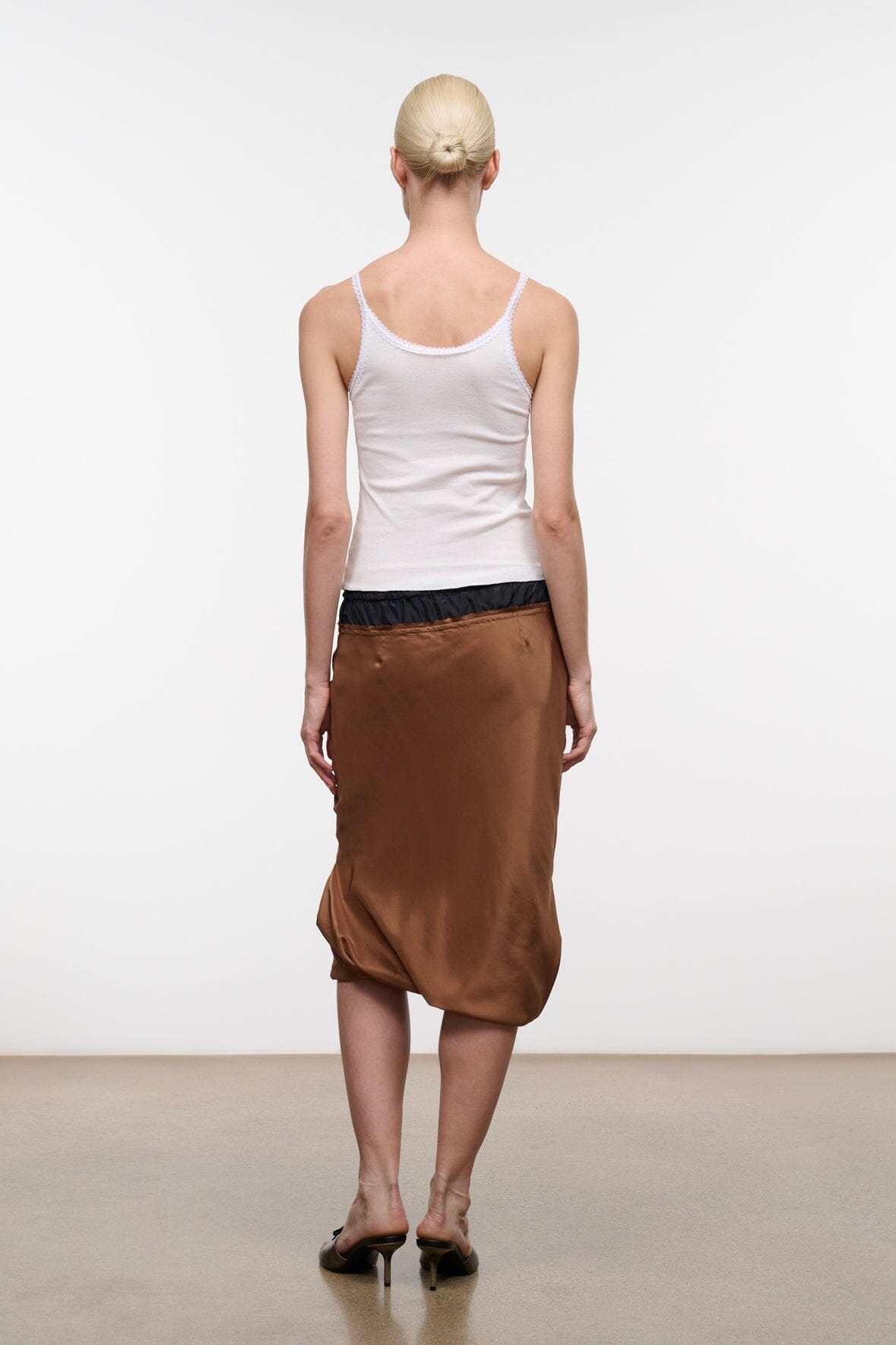 Silk midi skirt in dark brown with black elastic waistband and drawstring ties