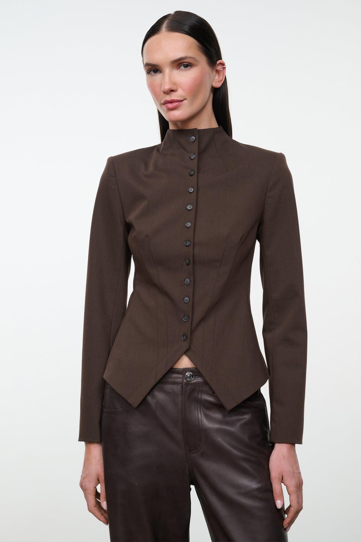 Women's brown fitted jacket with stand collar, button front, and asymmetric hem