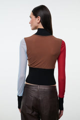 Back view color-block mock-neck long-sleeve top in brown, black, red, and light blue