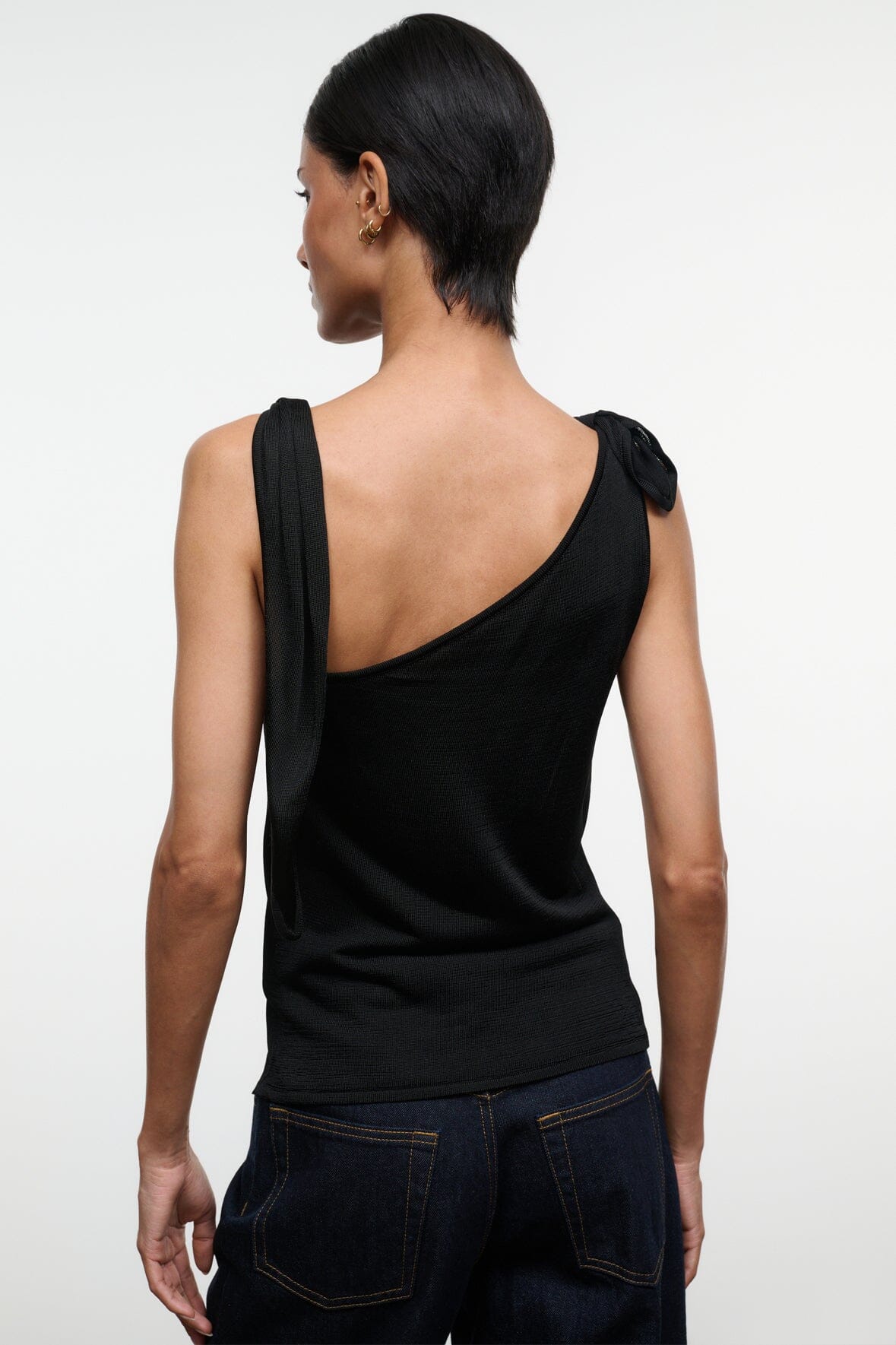 Black sleeveless top with cowl neckline and draped back detail