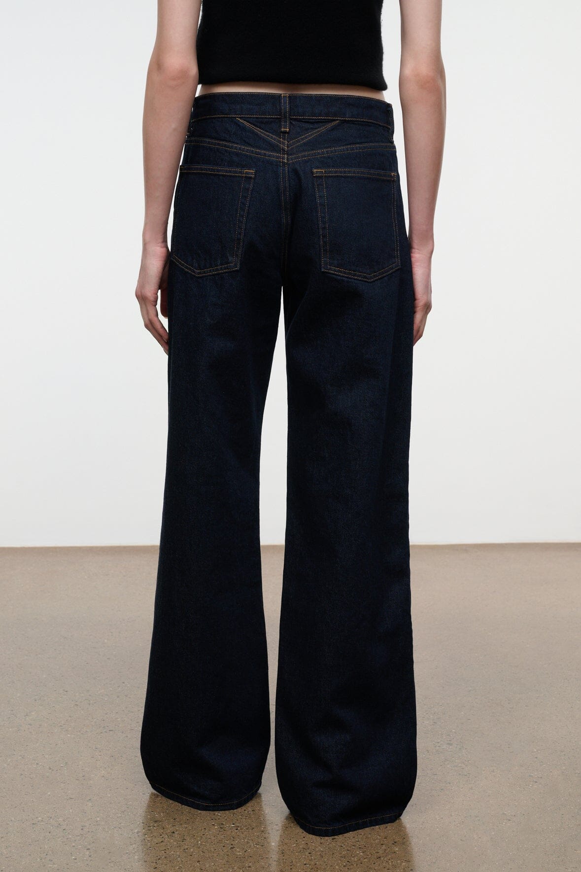 GUS relaxed jeans in dark indigo, back view with patch pockets and wide straight hem