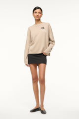 Stone cashmere crewneck sweater with long sleeves and embroidered animal chest
