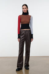 Mock-neck color-block long-sleeve top with black waistband panel and red/blue sleeves