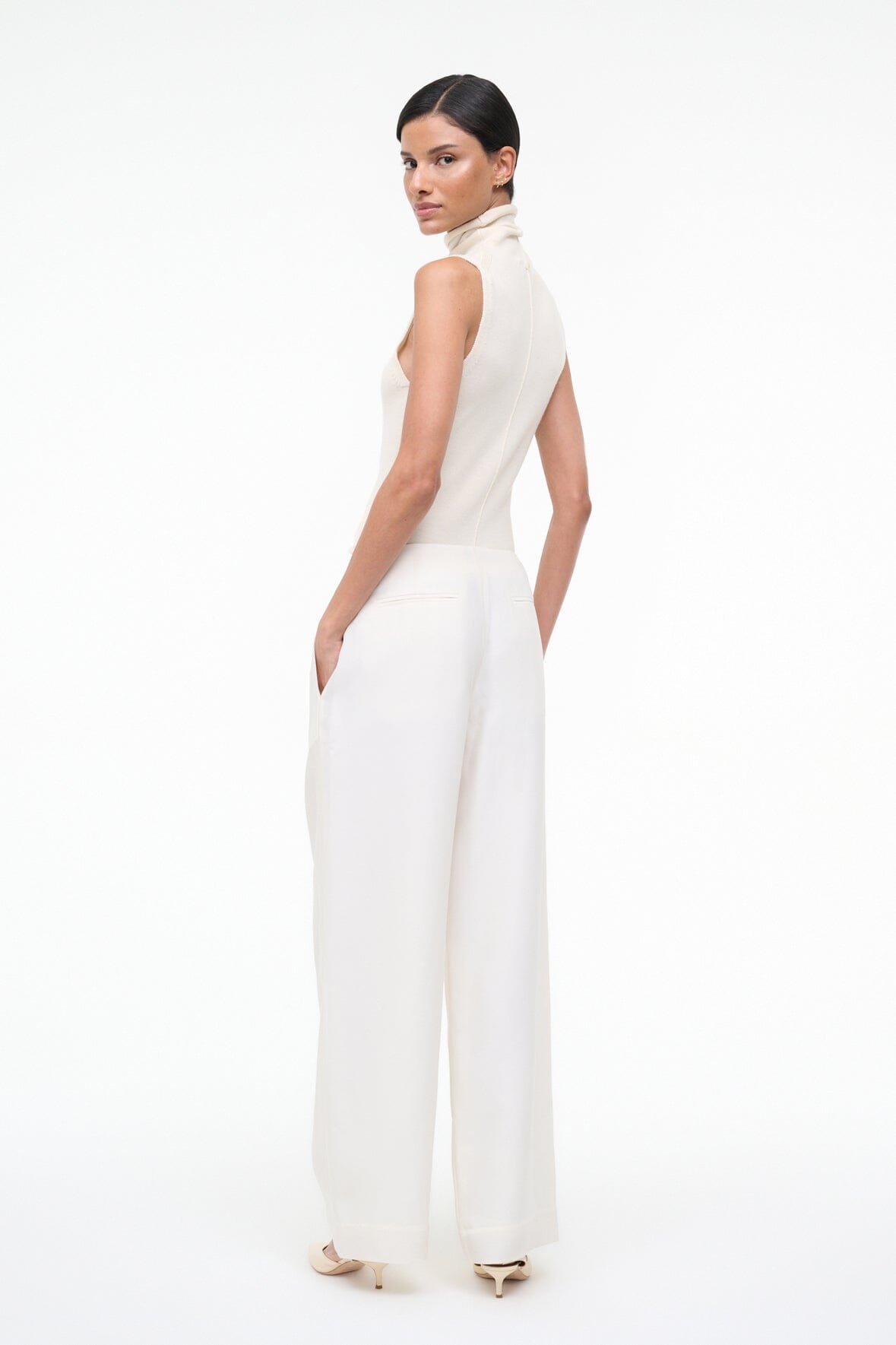 Pierre ivory wide-leg trousers in a straight drape, side view