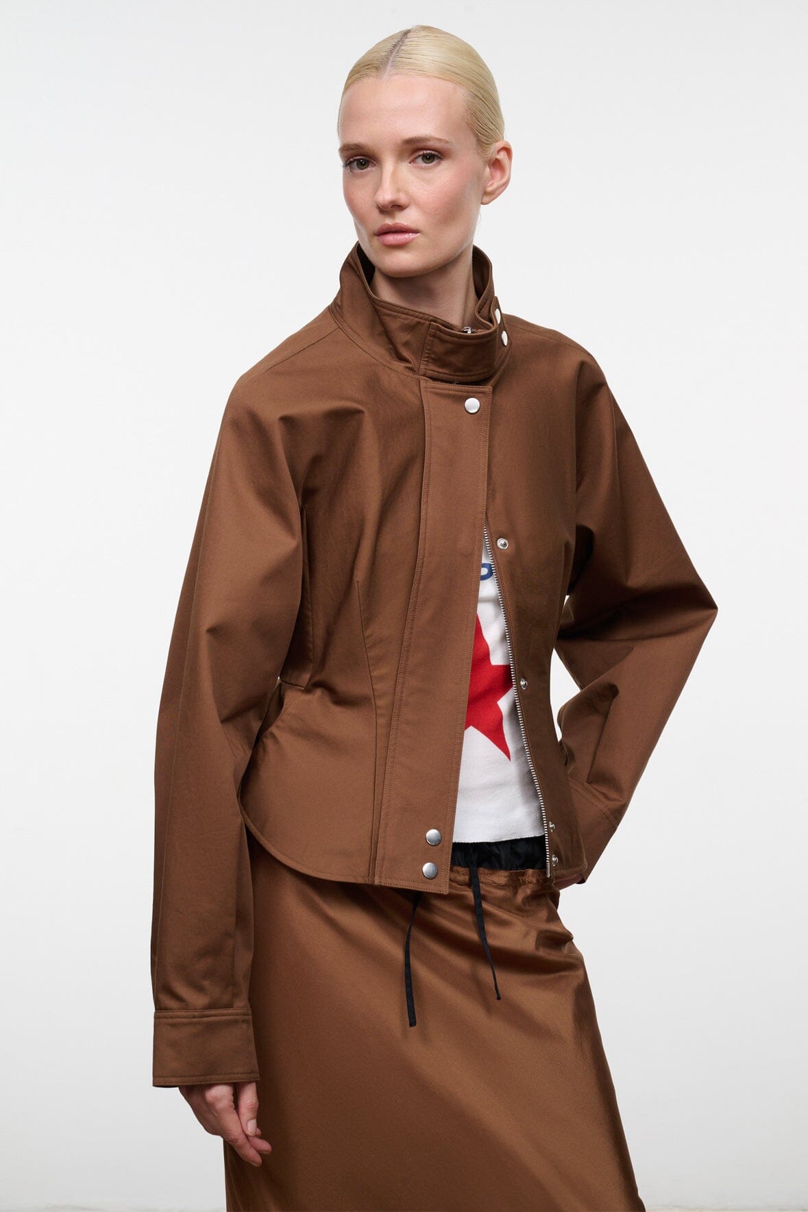 Cigar brown zip-up jacket with high collar, snap buttons, and drawstring hem pockets