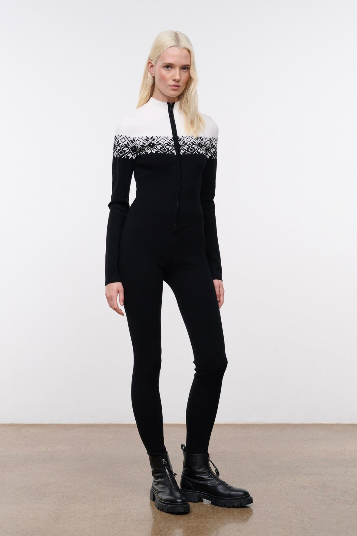 Black snowboard onesie with white fair isle yoke and zip-front, long sleeves