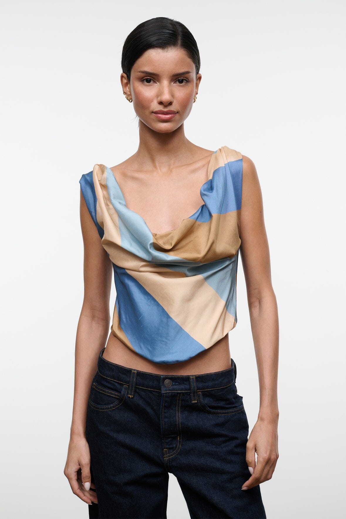 Sleeveless silk top with draped cowl neckline, tan and blue geometric stripe