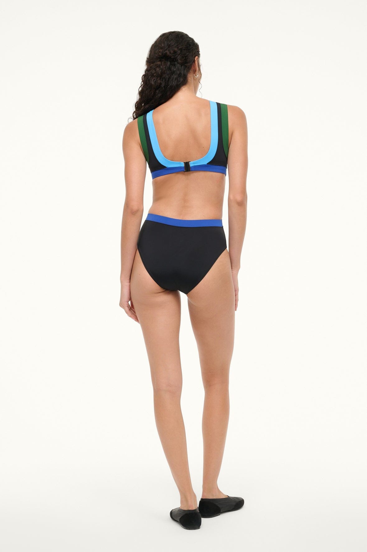 Black one-piece swimsuit with blue collar and green side panels, back view.