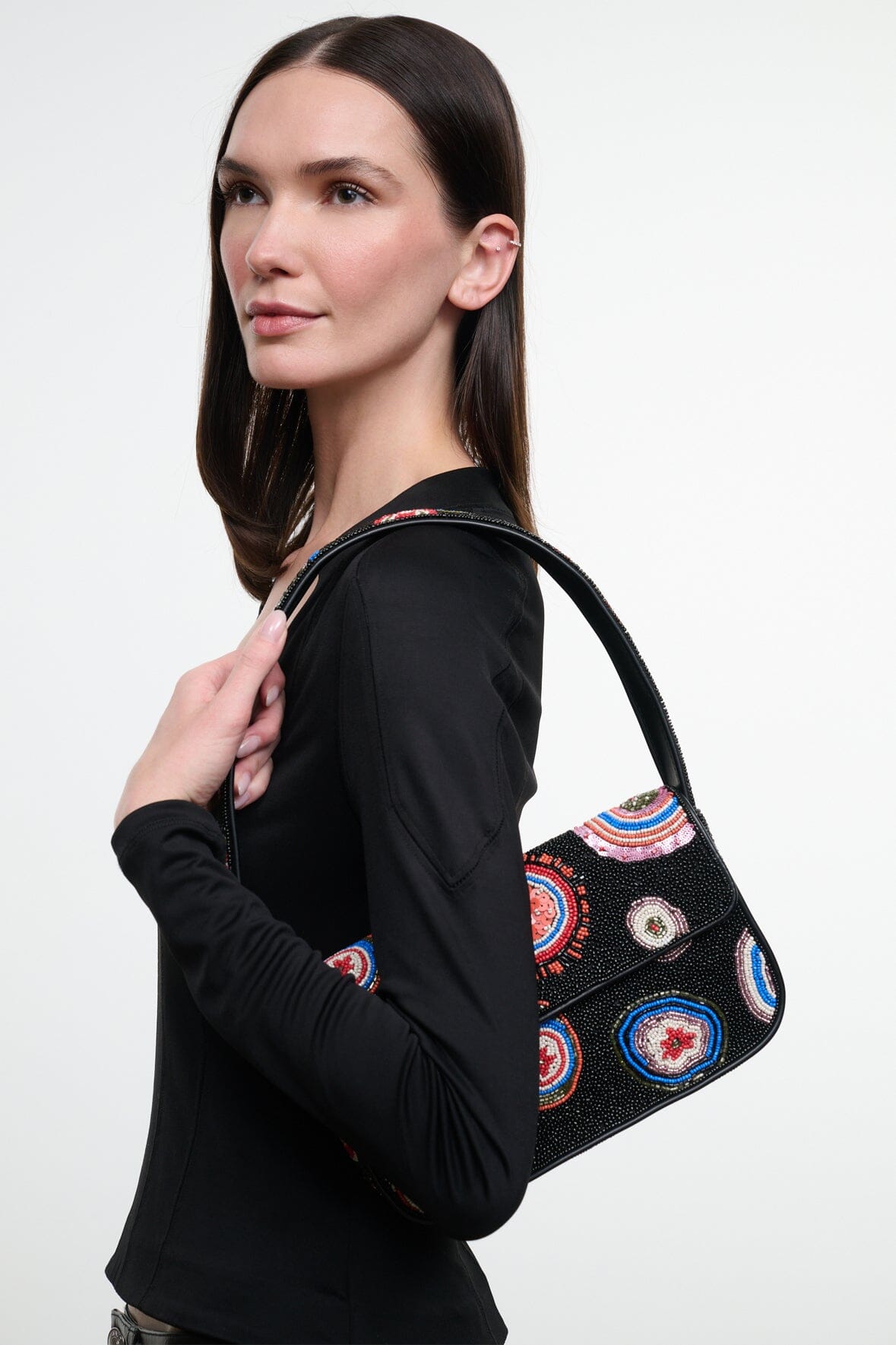 Black beaded handbag with multicolor circular embroidery, top handle and flap detail