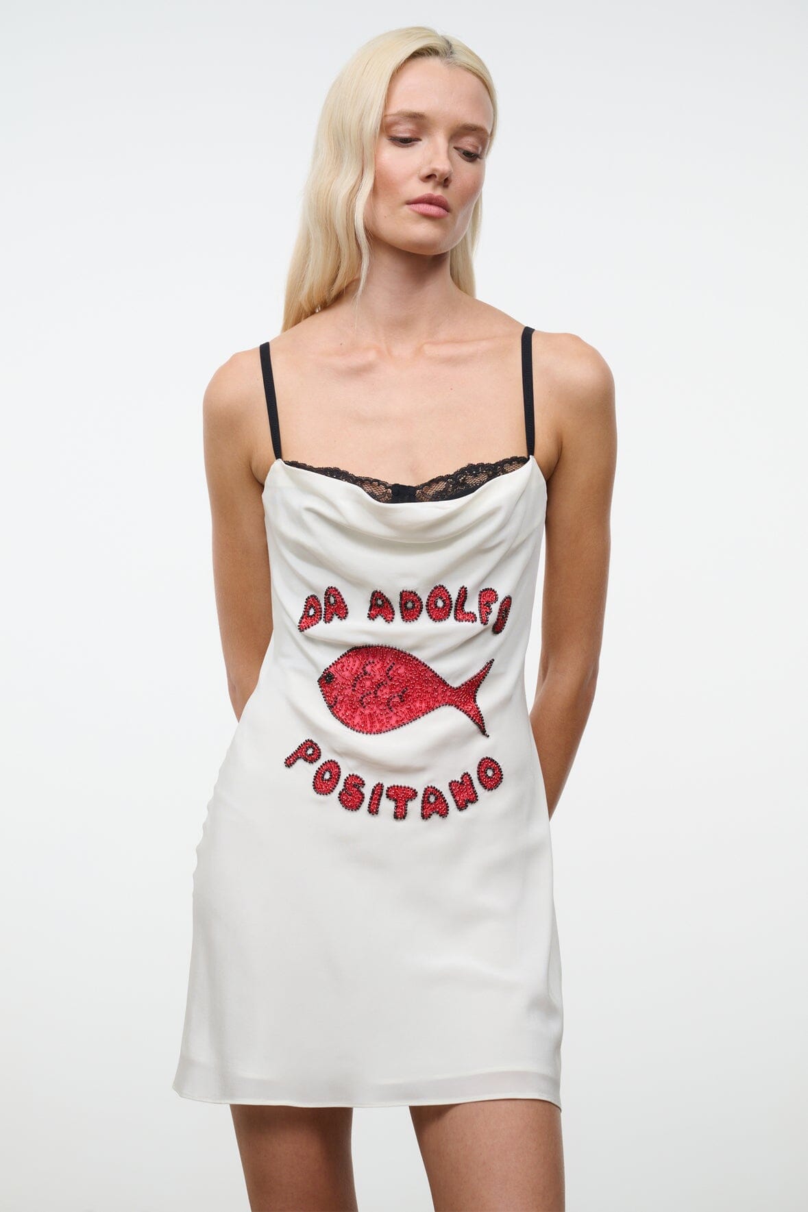White mini dress with black lace-trimmed straps and red fish graphic on front