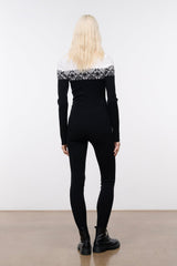 Black snowboard onesie with white fair isle yoke and zip-front, long sleeves, back view