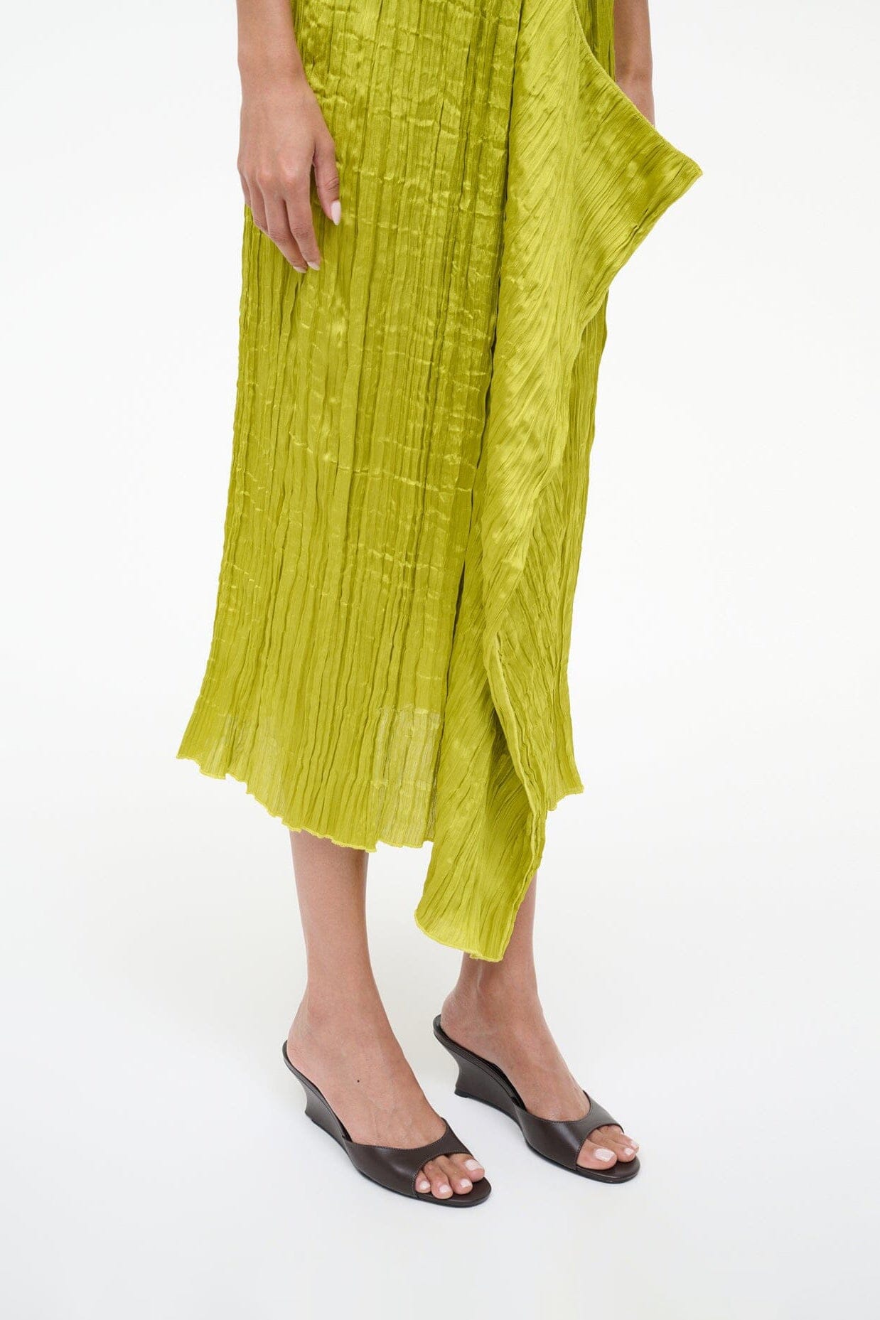 Espresso brown wedge slide sandals worn with midi skirt, open toe