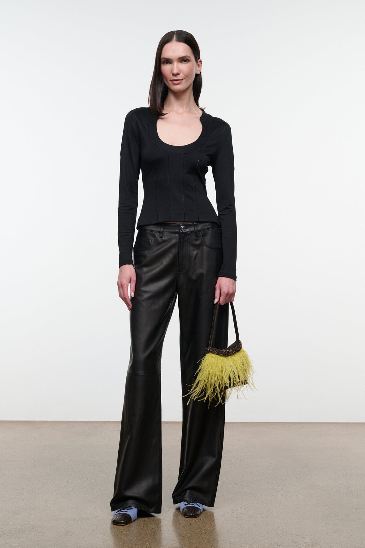 Black long-sleeve scoop-neck top with smooth front and fitted silhouette