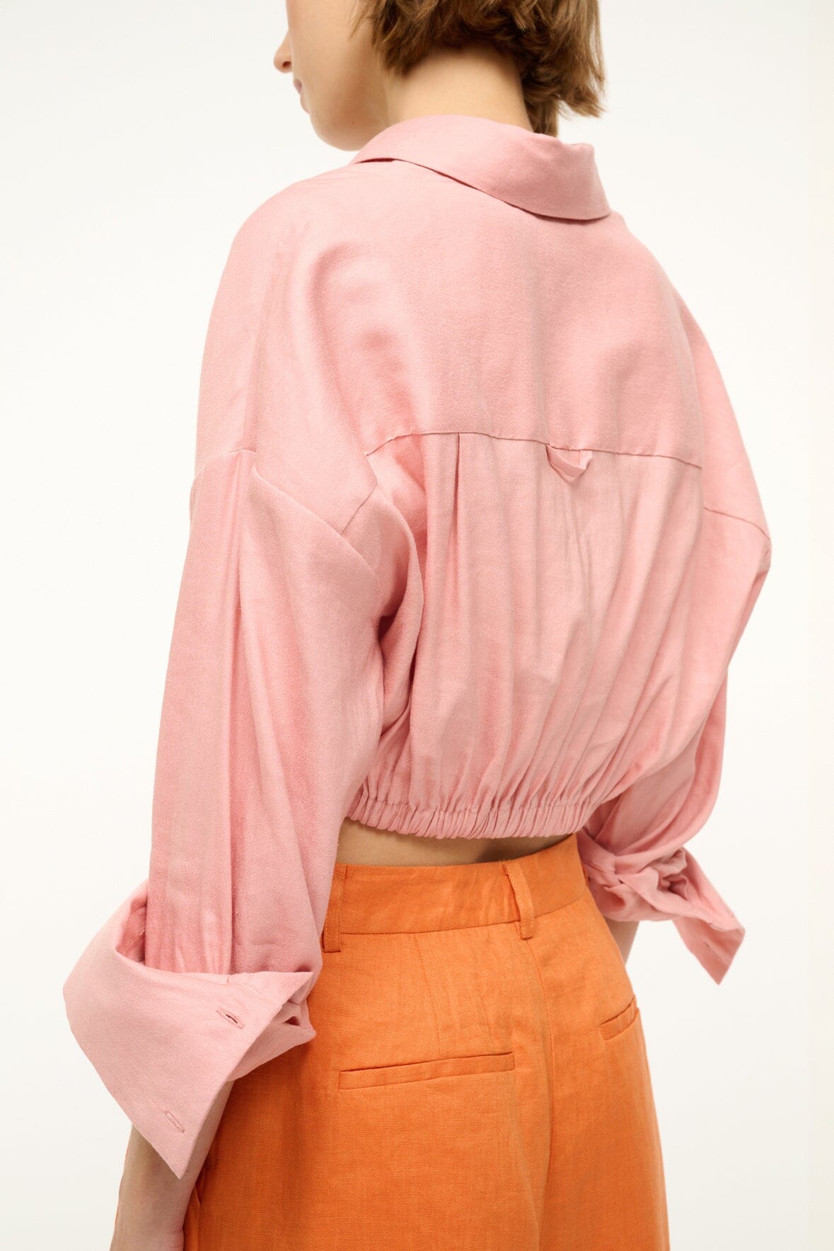 Faded blush linen button-up top back detail with gathered yoke and tied waist