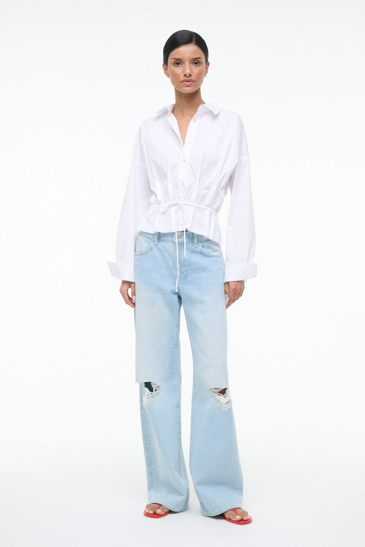 White button-up shirt with collar, V-neck, long sleeves, cinched waist