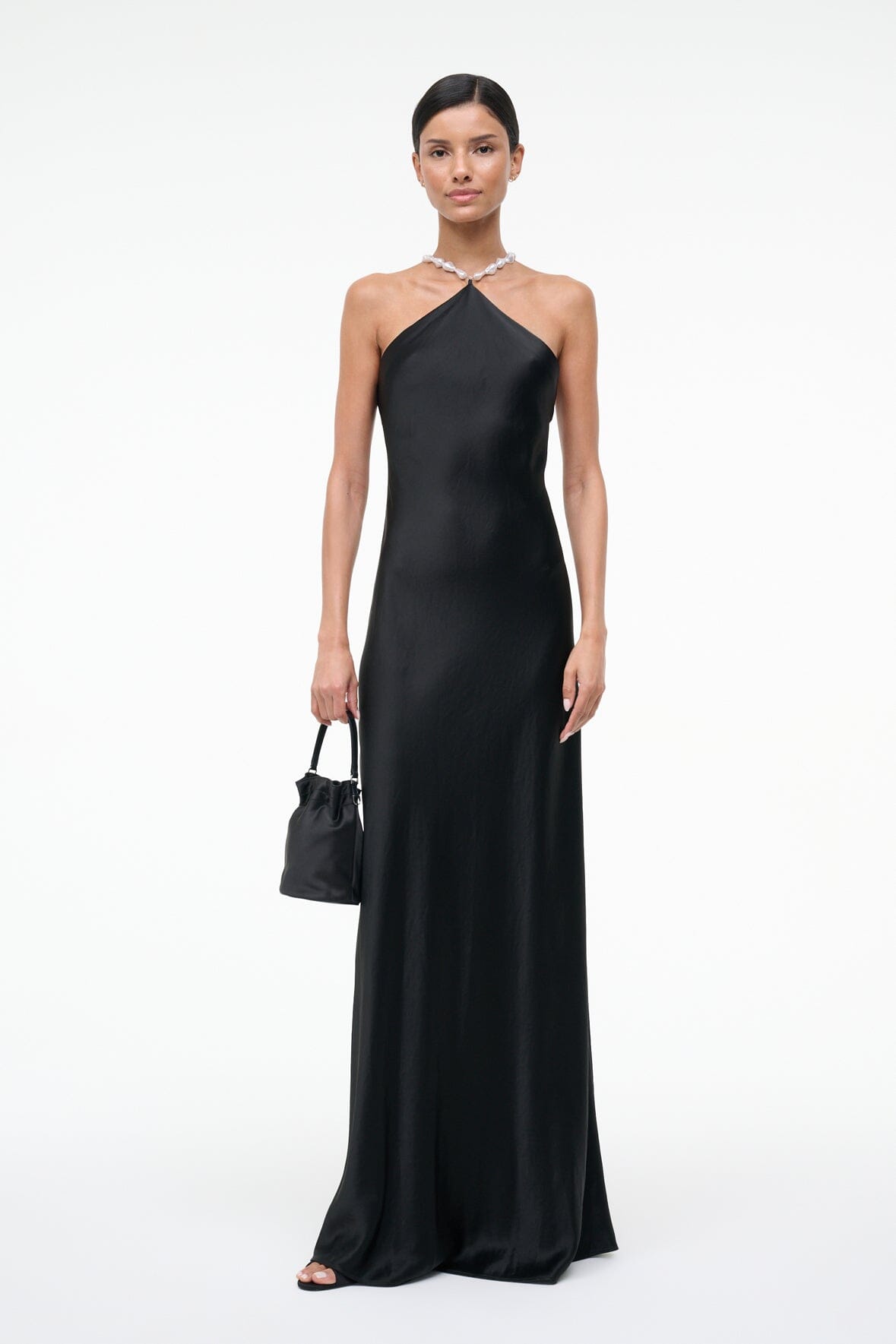 Black halter maxi dress with draped halter neckline and chain straps