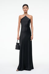 Black halter maxi dress with draped halter neckline and chain straps