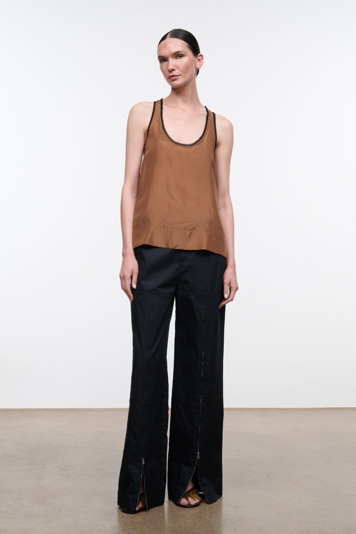 Brown silk tank top with contrast black scoop neck and racerback trim