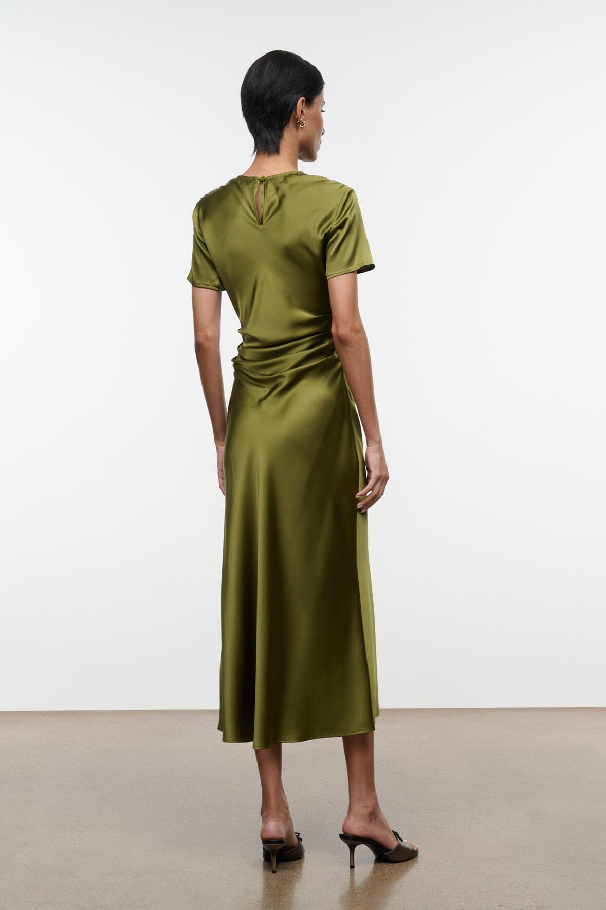 Olive green silk midi dress with short sleeves, draped ruched back view