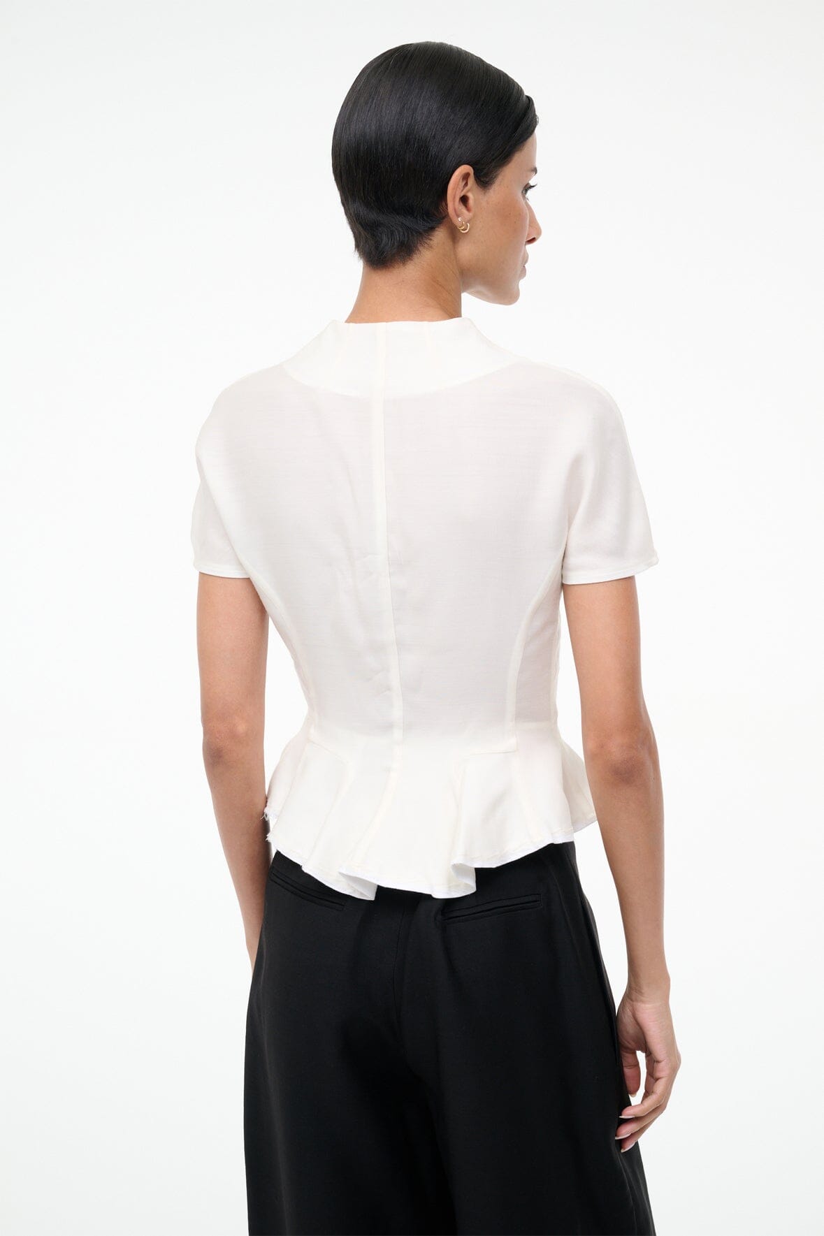 Ivory peplum back top with short sleeves and vertical seam detailing