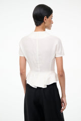 Ivory peplum back top with short sleeves and vertical seam detailing