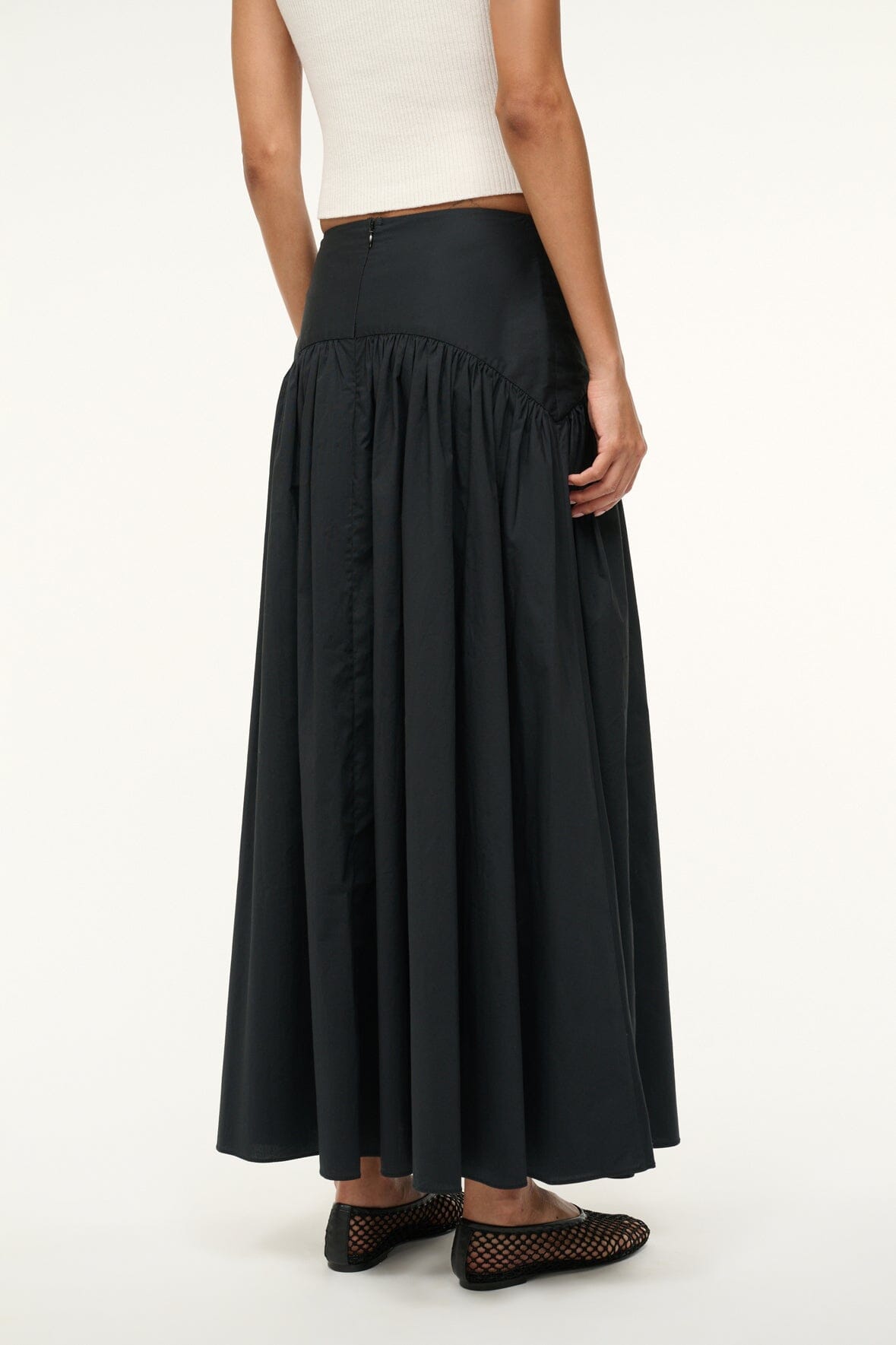 Black midi skirt with gathered waist and pleated panels