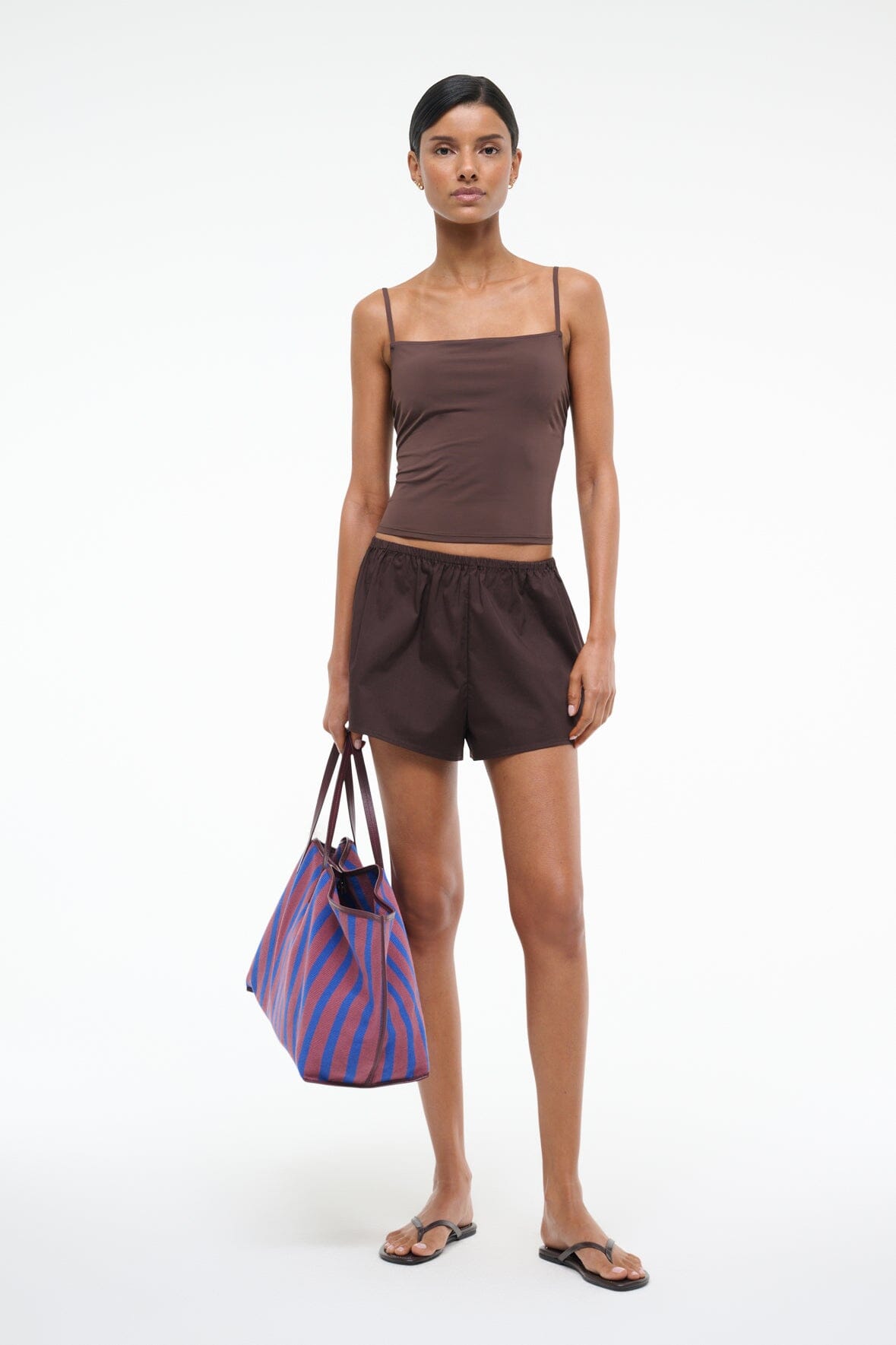 Dark brown tankini top with thin straps and ruched bust