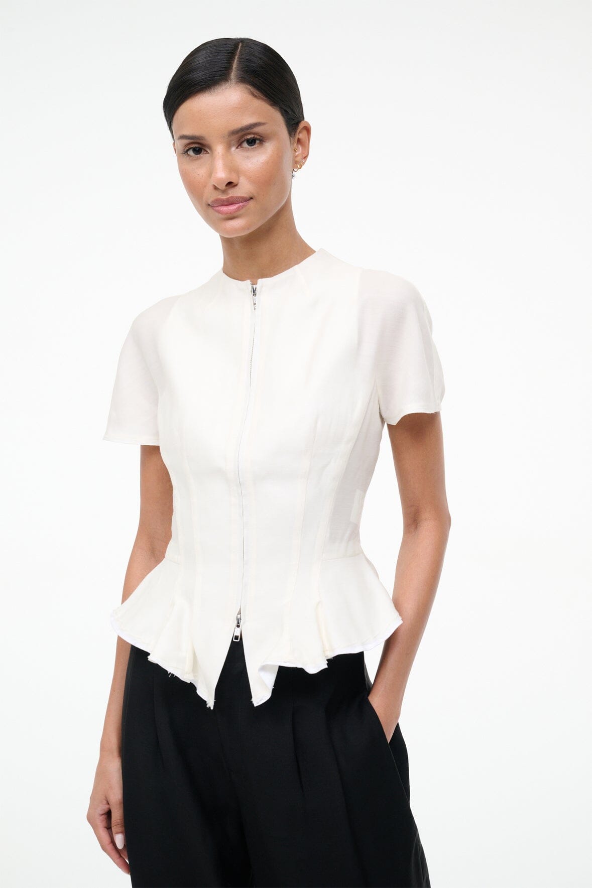Ivory peplum zip-front top with short sleeves and pointed flared hem