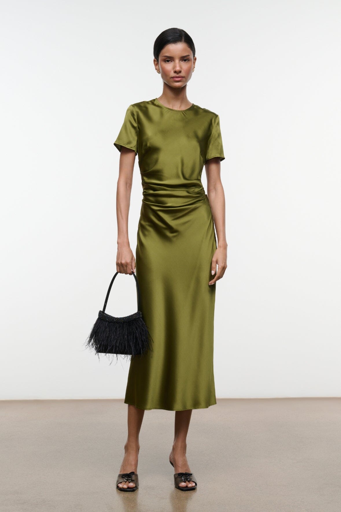 Olive green silk midi dress with short sleeves and ruched drape at the waist