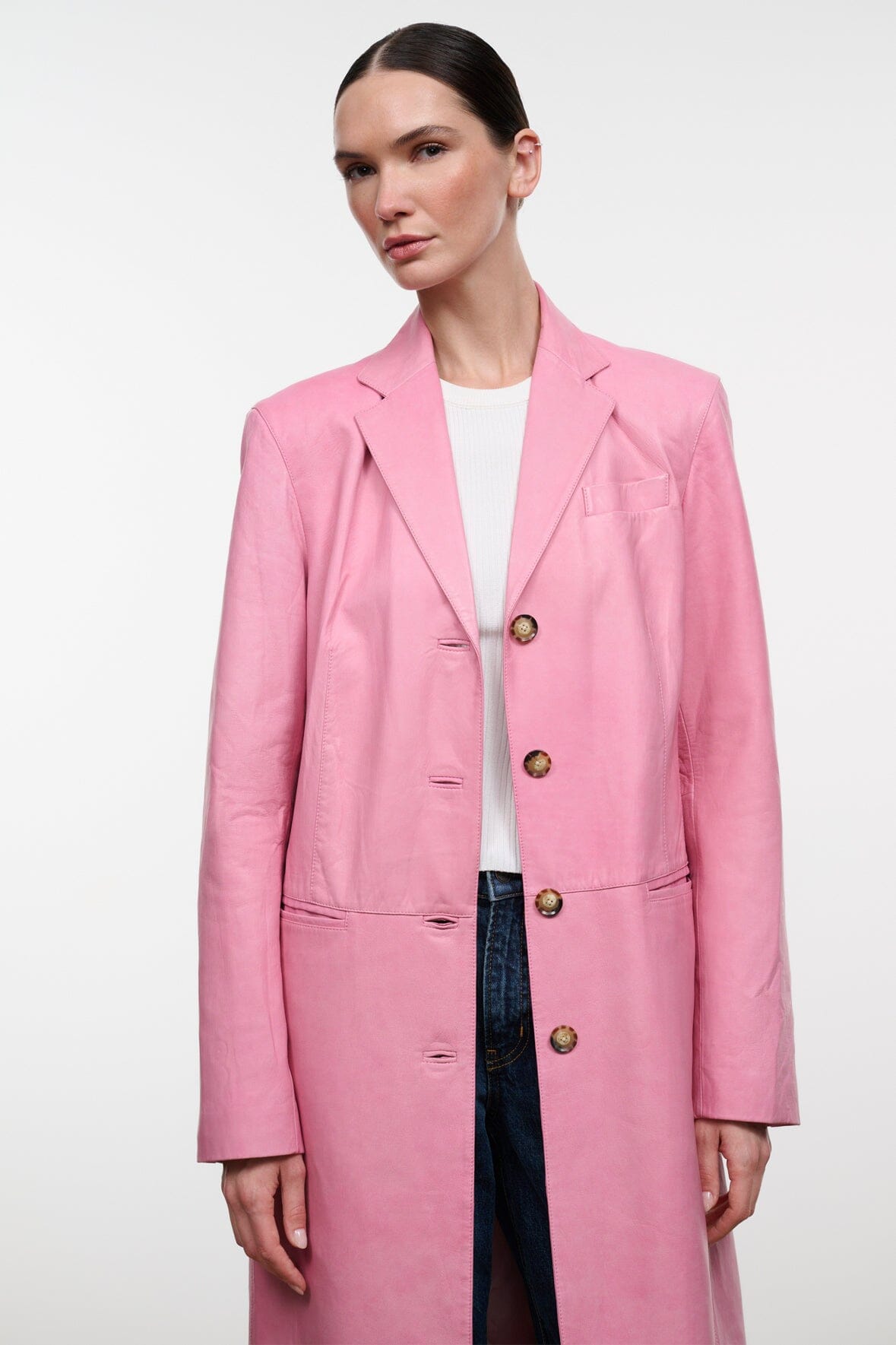 Pink leather coat with notch lapels and gold-tone button front